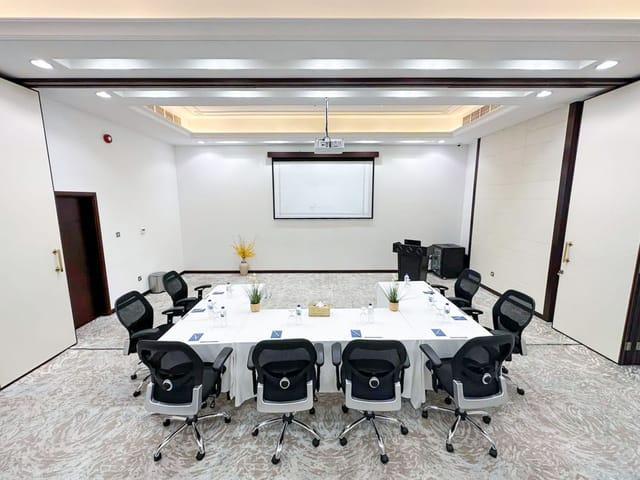 Ballroom in Al Diyafa with U-shaped table, ideal for conferences and meetings.