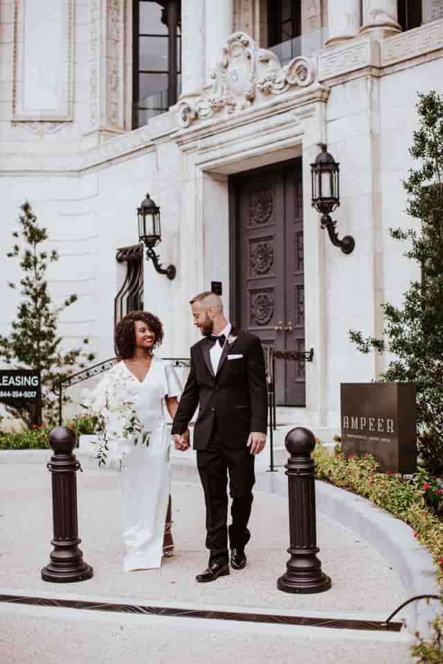 Elegant couple outside Patterson Mansion ballroom, perfect venue for upscale weddings.