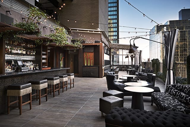 Stylish rooftop bar at Upstairs Lounge, perfect for upscale cocktail receptions and parties.