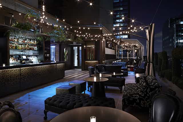Sophisticated rooftop venue with skyline view, perfect for cocktail receptions.