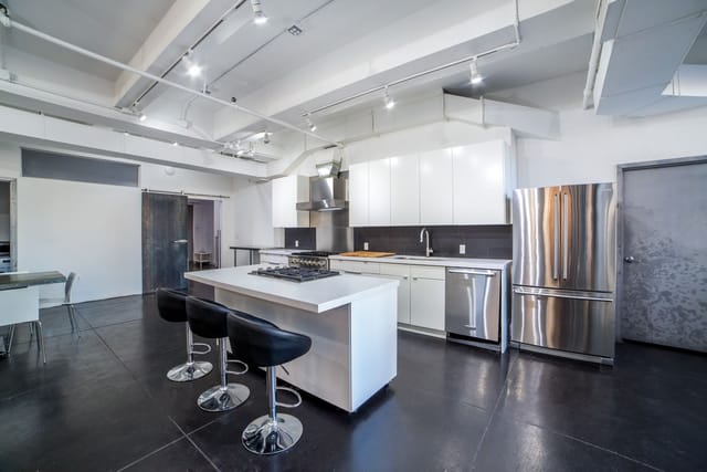 Modern kitchen in Green Room for cooking classes and intimate meetings.