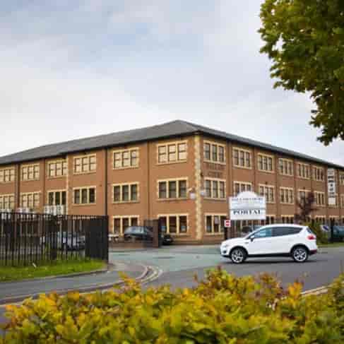 Modern conference center with brick exterior, ideal for corporate meetings and events.