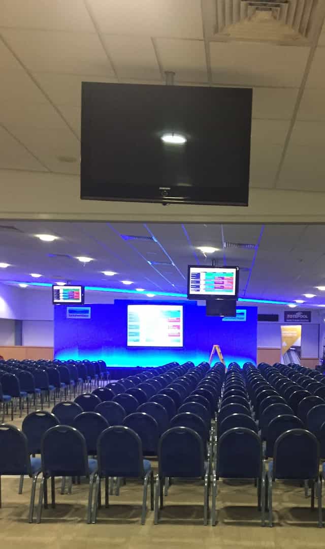 Bramham Hall event space, stage setup, modern conference in Wetherby Racecourse