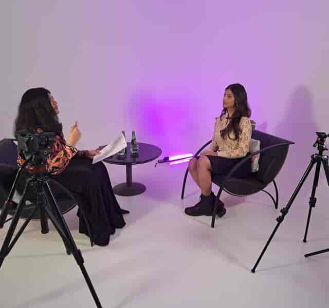 Professional interview setup in minimalist studio, perfect for events and content production.