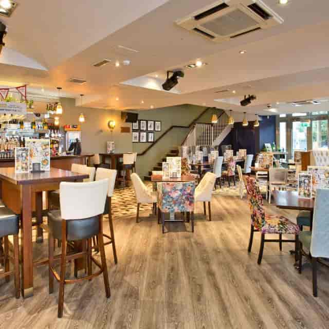 Versatile event space in Slug And Lettuce Didsbury with inviting decor for networking events.