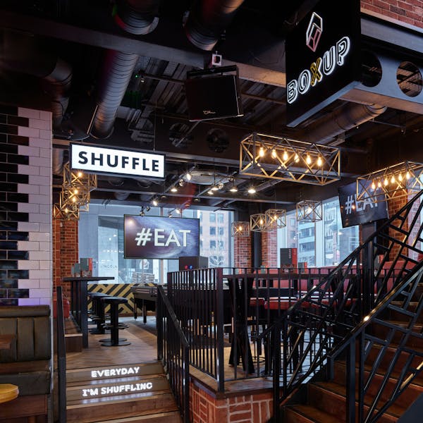 Modern BOX Deansgate venue with exposed brick, perfect for social gatherings and corporate events. - Banner