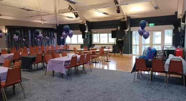 Function room at Unsworth Cricket Club with festive purple balloons, ideal for workshops and receptions.