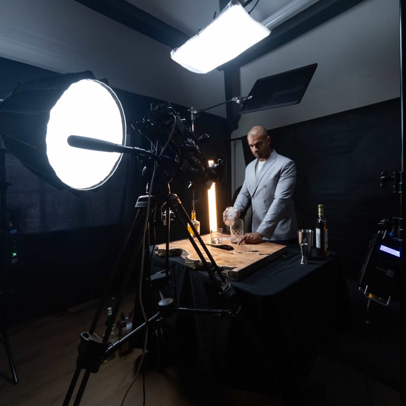 Sophisticated virtual event studio with professional backdrop and mixologist setup