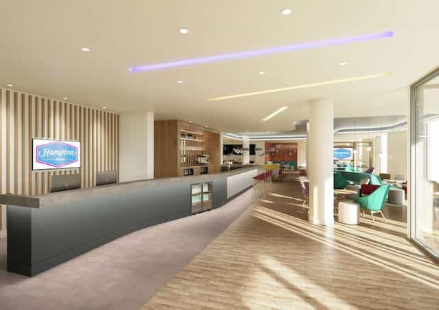 Modern lobby at Hampton by Hilton Manchester, ideal for conferences and networking.