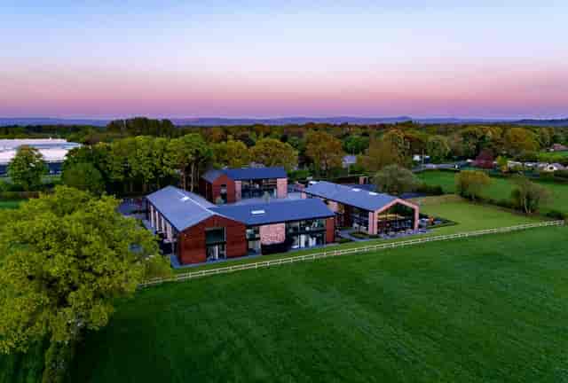 Outdoor meeting rooms with modern architecture for weddings and corporate retreats.