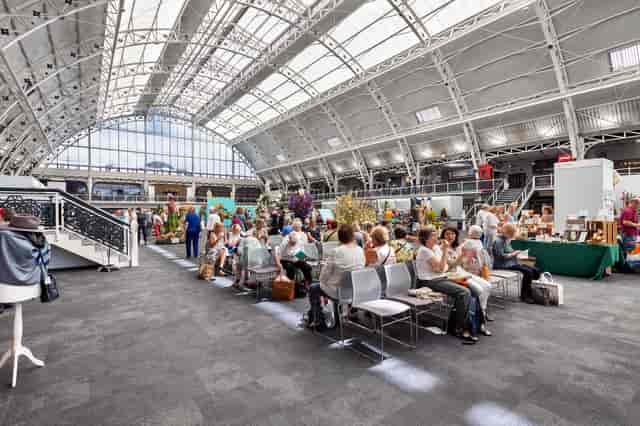 Vibrant event space with high ceilings for networking and collaboration gatherings.