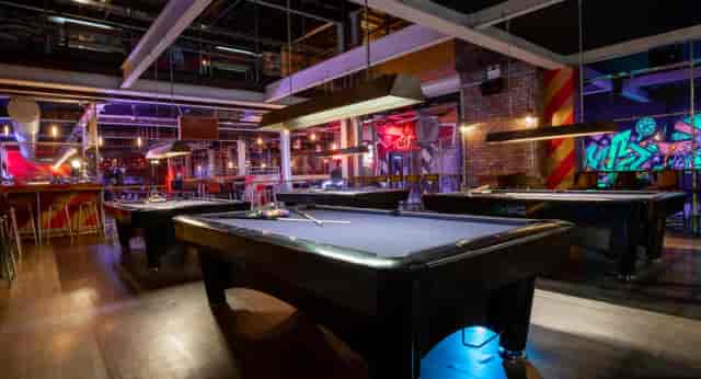 Vibrant Roxy Ball Room bar with pool tables, ideal for social gatherings and networking events.