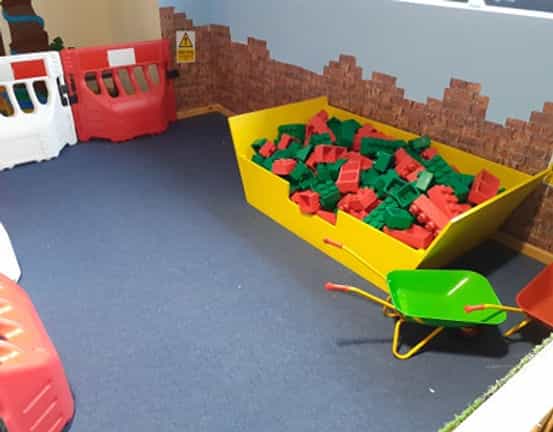 Vibrant indoor playground with colorful building blocks for children's events.