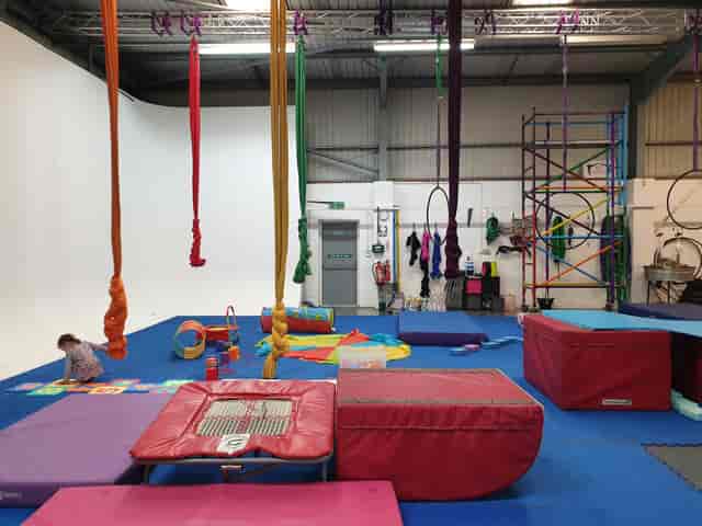 Acrobalance in Cloud Aerial Arts with colorful silks for dynamic events and fitness classes.