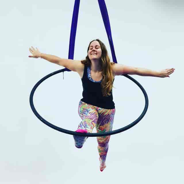 Aerial performer in hoop art at Cloud Aerial Arts for unique event entertainment.