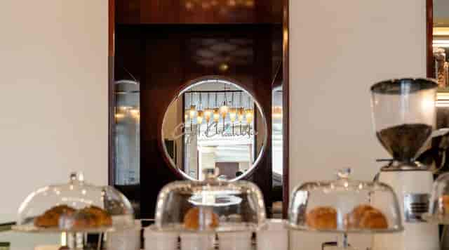 Café Columbia refreshment station with pastries, perfect for elegant professional events.