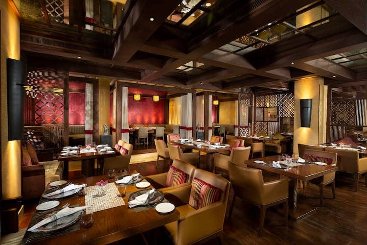 Elegant dining space at Beach Rotana, perfect for private events and networking dinners.