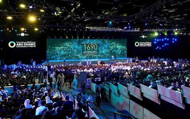 ICC Abu Dhabi conference with packed audience and dynamic lighting for impactful events