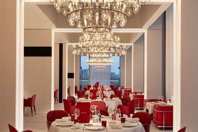 Elegant restaurant dining space with chandelier, perfect for upscale events in Abu Dhabi.