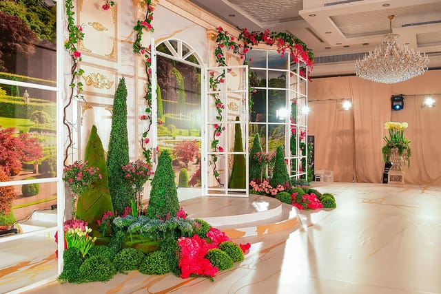Gold Ballroom B with floral backdrop, ideal for weddings and corporate events.