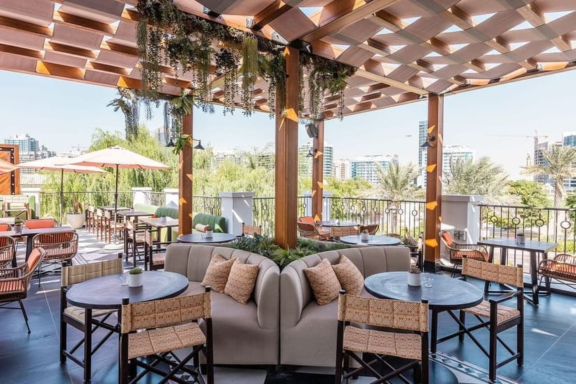 Stylish outdoor event space at The Green Room with city views and greenery.
