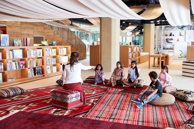 Children's library with colorful rugs, perfect for creative workshops and educational events.