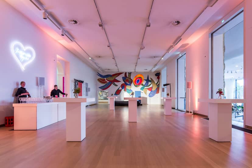 Elegant event space at Stedelijk Museum, pink lighting for upscale receptions and exhibitions.