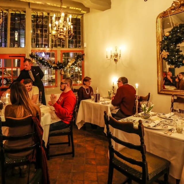 Intimate dining setting at De Silveren Spiegel, perfect for private events and networking.