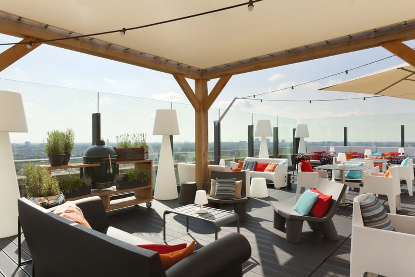 Stylish rooftop restaurant with modern decor, perfect for cocktail receptions and events.
