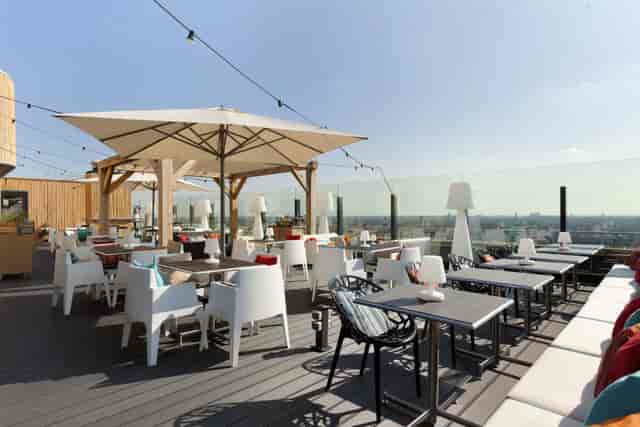 Stylish rooftop restaurant with panoramic views, ideal for corporate events and gatherings.