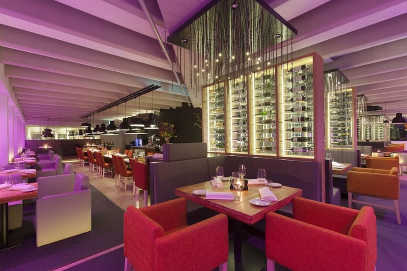 Stylish cocktail bar with modern décor, perfect for social events and meetings.