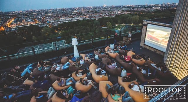 Rooftop movie night on Floor17 with cozy bean bags and cityscape backdrop for events.