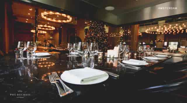 Elegant private dining setup with seasonal decor, perfect for corporate events or gatherings.