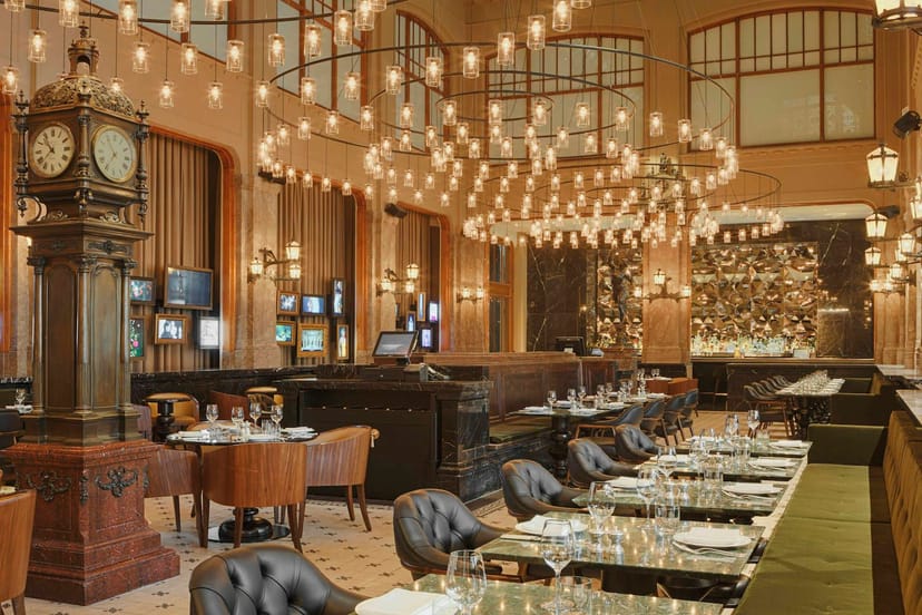 Elegant private dining venue with modern lighting, ideal for corporate dinners and upscale events.