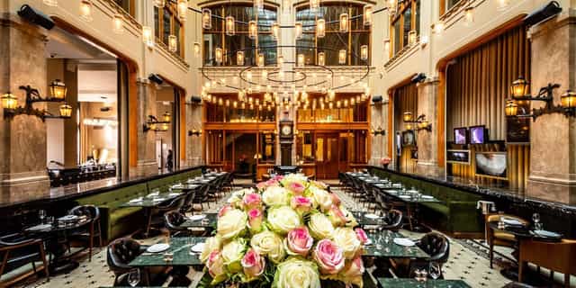 Elegant event space at The Duchess with floral centerpieces for corporate meetings.