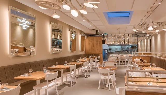 Modern seafood restaurant with flexible seating for gatherings and events.
