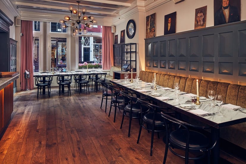 Semi-private dining room with marble table, perfect for business meetings and events.