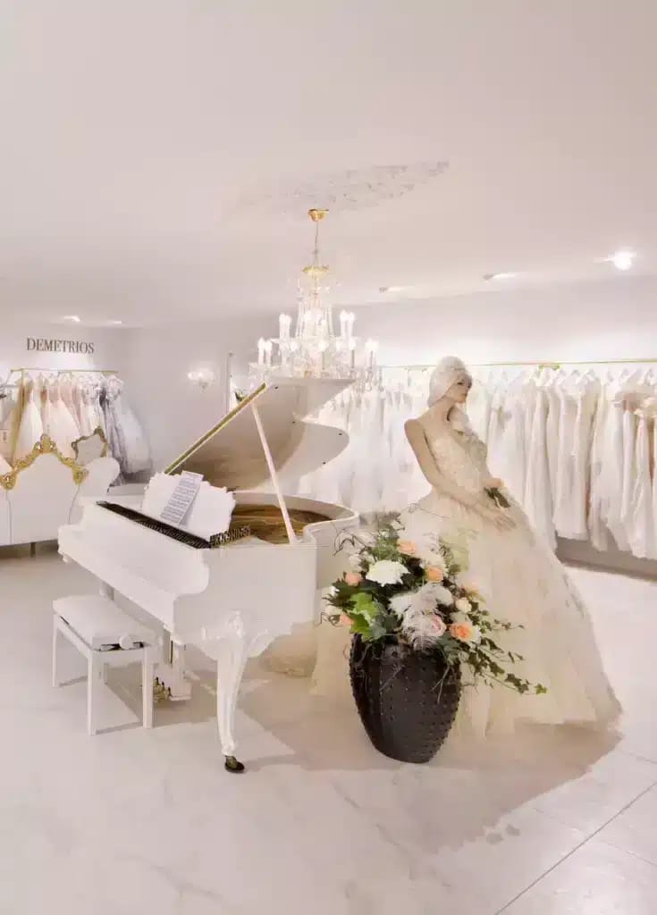 Elegant bridal boutique with white piano, ideal for wedding planning events.