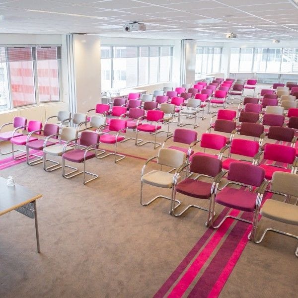 Colorful chairs in La Place meeting room for vibrant workshops and presentations.