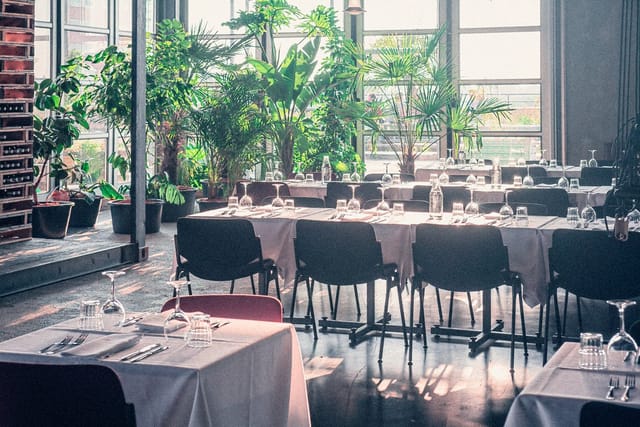 Private dining space at Bar Bistro Bureau with white table linens, ideal for events.
