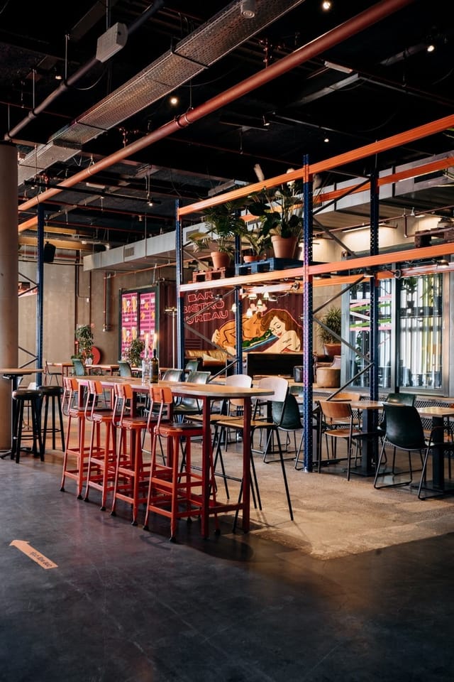Private dining space in Bar Bistro Bureau with industrial decor, ideal for events and meetings.