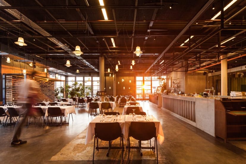 Private dining in modern industrial space with elegant seating for corporate events and gatherings.