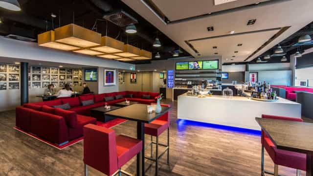 Modern Sky Club lounge in Johan Cruijff ArenA, perfect for networking events and gatherings.