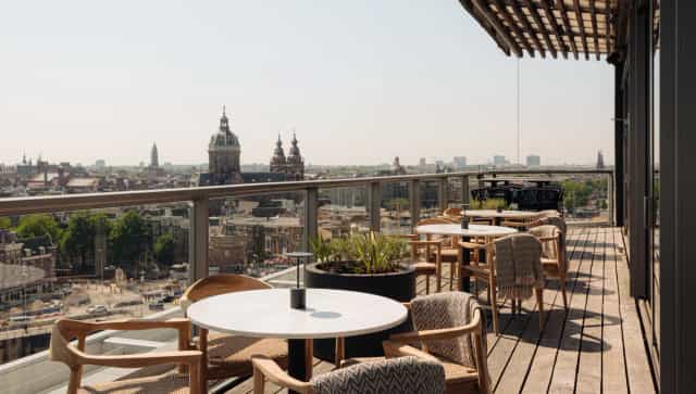 Rooftop terrace bar at Art Hotel Amsterdam with stunning city views for events and meetings.