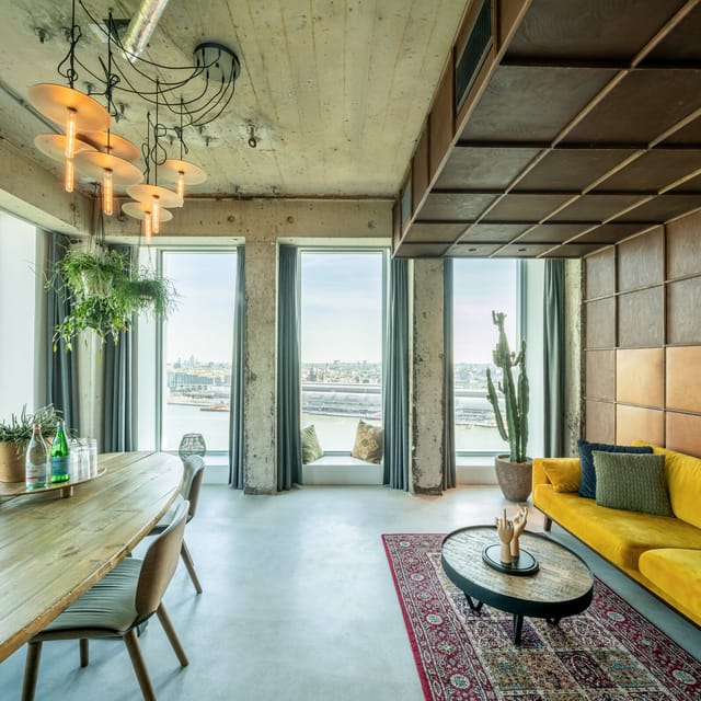 Modern A'DAM Toren observation deck with large windows for meetings and events.