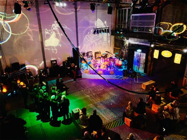 NDSM Theater: vibrant event space with dynamic lighting for creative gatherings.