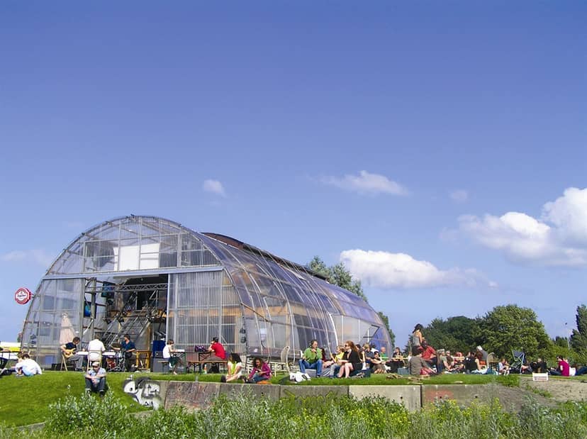 Café Noorderlicht in NDSM, vibrant glass structure, perfect for meetings and events.