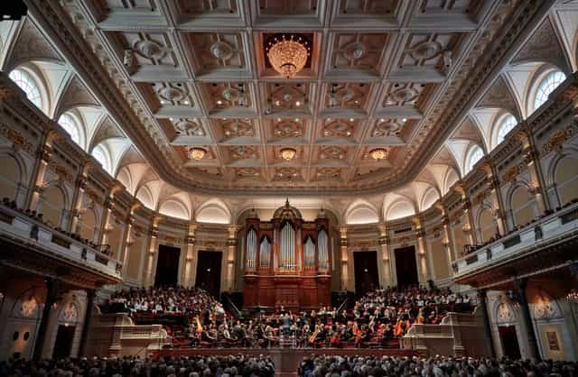 Royal Concertgebouw Choir Hall with ornate ceiling, ideal for concerts and events.