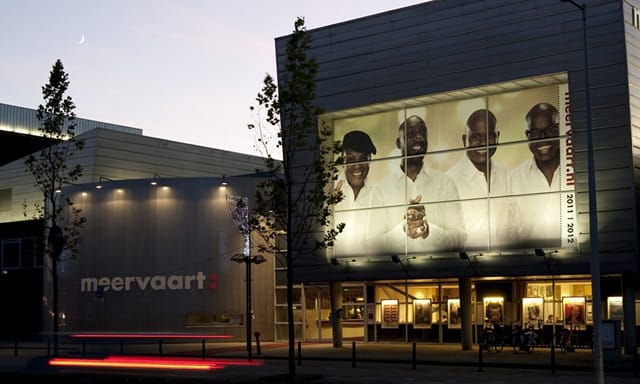Modern Meervaart Theater exterior, illuminated for conferences and performances.