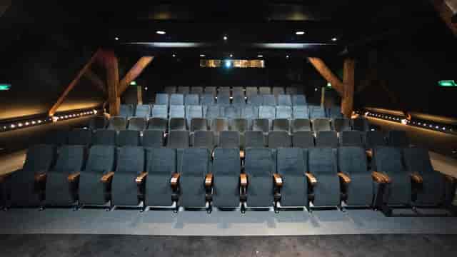 Modern auditorium with tiered seating in Melkweg for corporate events and screenings.